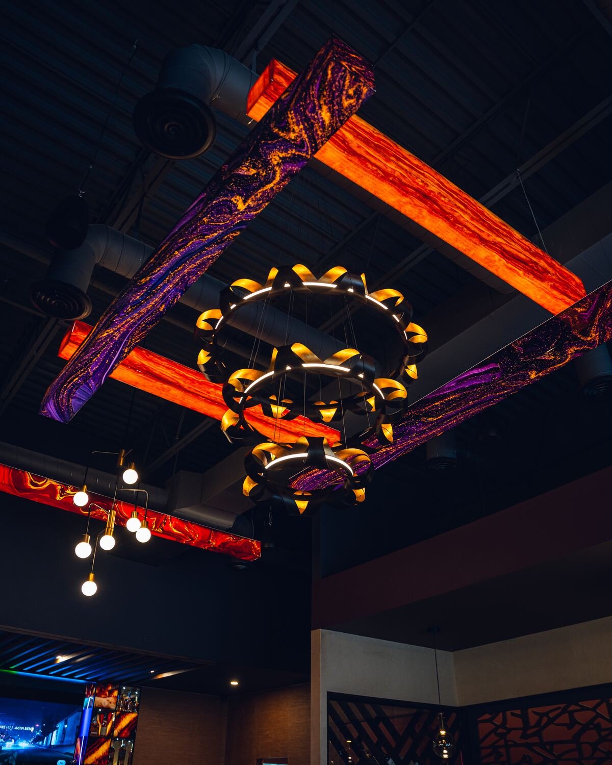 Sculptural lighting above the Karma dining room